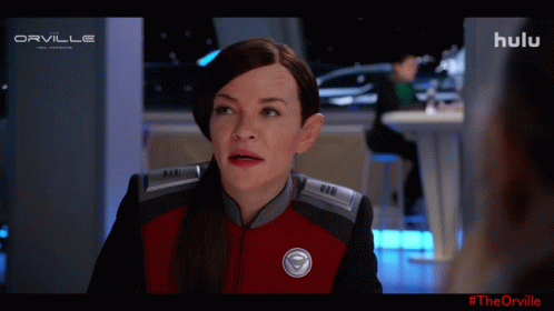 A Woman In A Red And Black Uniform With The Word Orville On The Top Left GIF