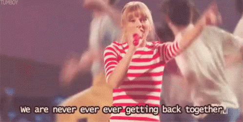 A Woman In A Red And White Striped Shirt Is Singing Into A Microphone With The Words " We Are Never Ever Ever Getting Ba GIF