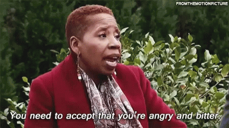 A Woman In A Red Coat And Scarf Is Saying `` You Need To Accept That You 'Re Angry And Bitter '' GIF