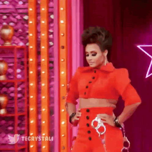 Woman In Red Crop Top And Pants On Stage GIF