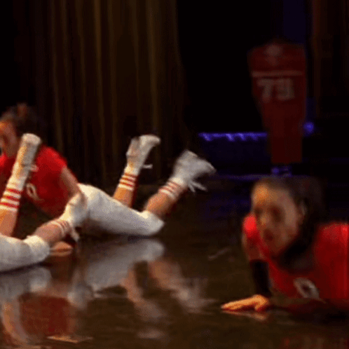 A Woman In A Red Crop Top With The Number 9 On It GIF