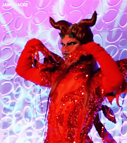 A Woman In A Red Devil Costume Has The Name Janeyjacke At The Bottom GIF