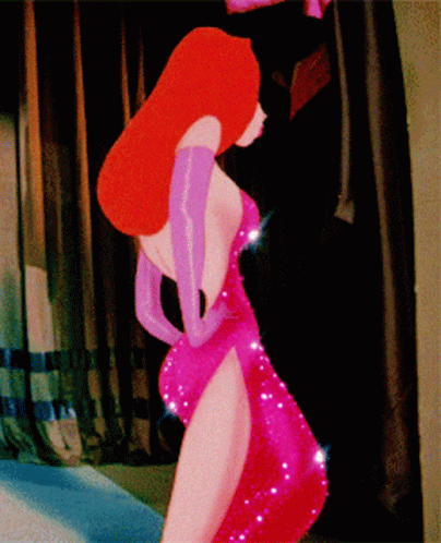 A Woman In A Red Dress And Purple Gloves Is Standing In A Room GIF