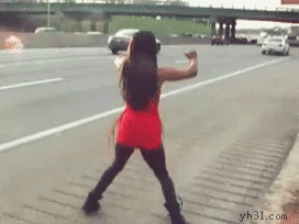 A Woman In A Red Dress Is Dancing On A Highway GIF