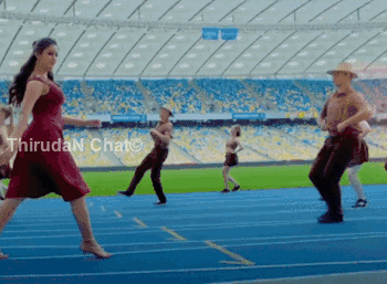 A Woman In A Red Dress Is Dancing On A Track In A Stadium With Thiruda N Chat Written In The Corner GIF
