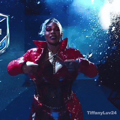 A Woman In A Red Dress Is Dancing With The Words Tiffanyluv24 Below Her GIF