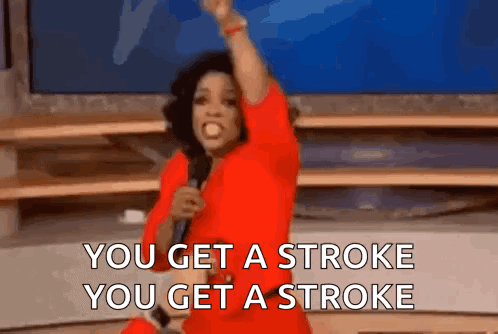 A Woman In A Red Dress Is Holding A Microphone And Says You Get A Stroke You Get A Stroke . GIF