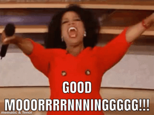 A Woman In A Red Dress Is Holding A Microphone With Her Arms In The Air And Says " Good " GIF