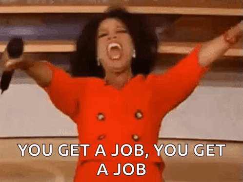 A Woman In A Red Dress Is Holding A Microphone With Her Arms In The Air And The Words You Get A Job GIF