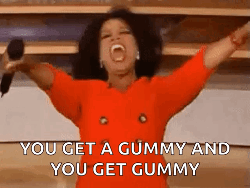 A Woman In A Red Dress Is Holding A Microphone With Her Arms Outstretched And Screaming . GIF
