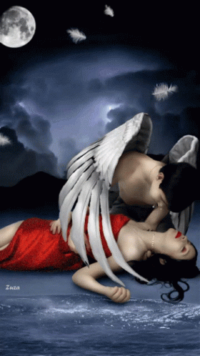 A Woman In A Red Dress Is Laying On The Ground With A Man With Angel Wings On Her Back GIF
