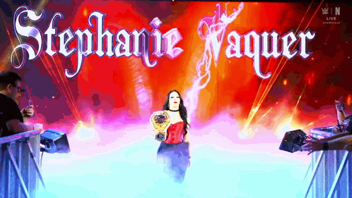 A Woman In A Red Dress Is On A Stage With The Name Stephanie Vaquer GIF