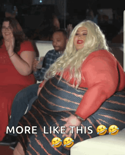 A Woman In A Red Dress Is Sitting On A Couch With The Words More Like This Above Her GIF