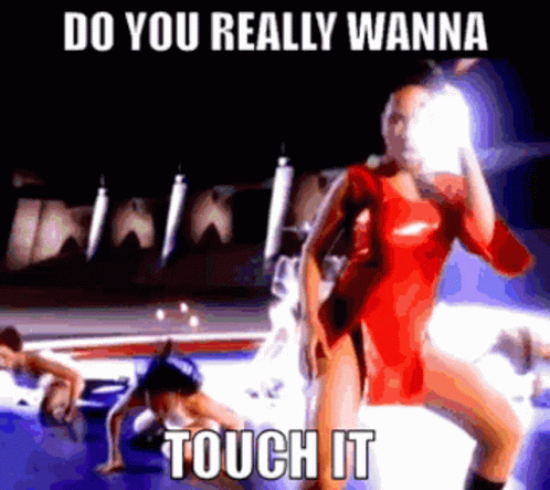 A Woman In A Red Dress Is Standing In Front Of A Car With The Words Do You Really Wanna Touch It . GIF
