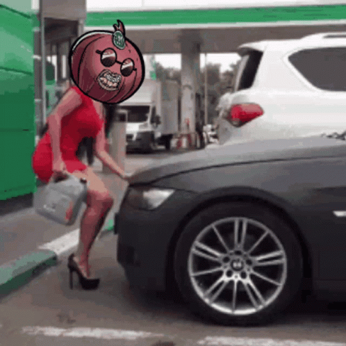 A Woman In A Red Dress Is Standing Next To A Black Car GIF