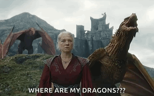A Woman In A Red Dress Is Standing Next To A Dragon And Asking Where Are My Dragons . GIF