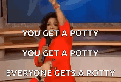 A Woman In A Red Dress Is Standing On A Stage Holding A Microphone And Making A Funny Speech . GIF