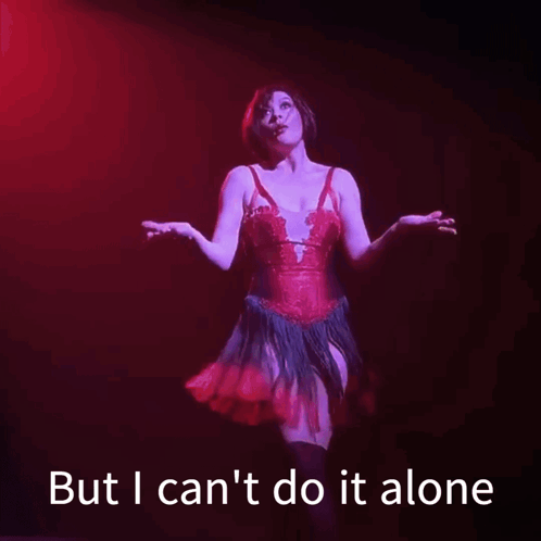 A Woman In A Red Dress Is Standing On A Stage With The Words But I Can 'T Do It Alone Below Her GIF
