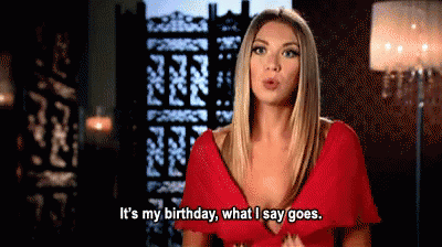 A Woman In A Red Dress Is Talking About Her Birthday GIF