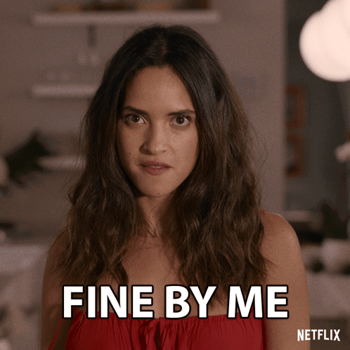 A Woman In A Red Dress Says " Fine By Me " GIF