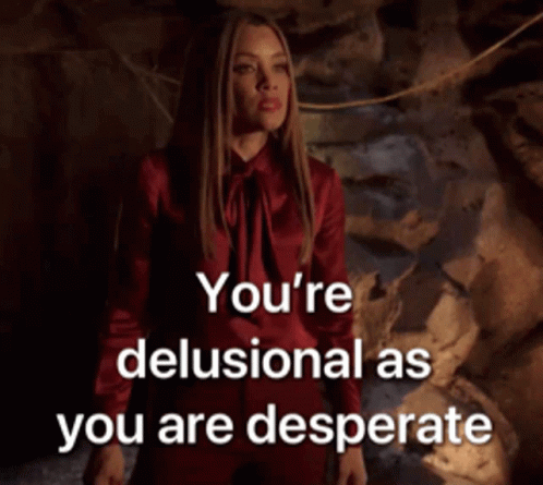 A Woman In A Red Dress With The Words You 'Re Delusional As You Are Desperate Above Her GIF