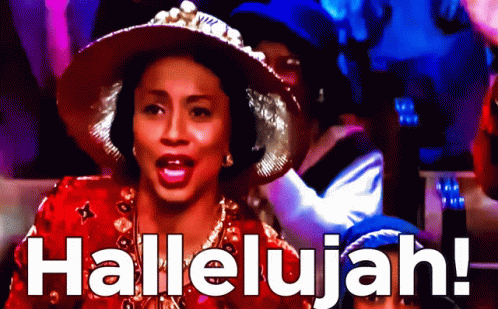 A Woman In A Red Hat Sings Hallelujah In Front Of A Crowd GIF