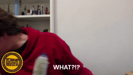 A Woman In A Red Hoodie Is Holding A Bottle And Asking What ? GIF