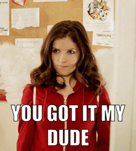 A Woman In A Red Hoodie Is Standing In Front Of A Bulletin Board That Says You Got It My Dude GIF