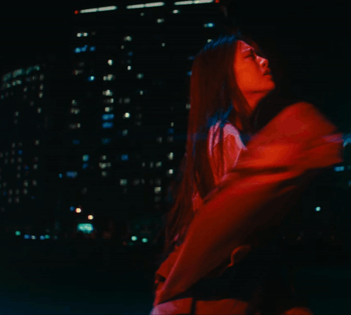 A Woman In A Red Jacket Is Crying GIF