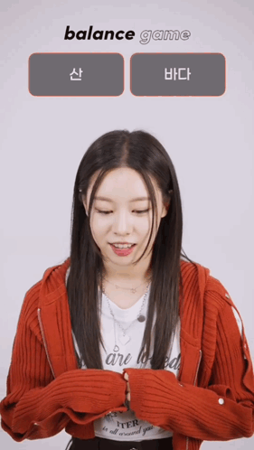 A Woman In A Red Jacket Is Playing A Game Called Balance Game GIF