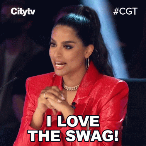 A Woman In A Red Jacket Is Sitting In Front Of A Microphone And Says " I Love The Swag " GIF