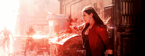 Woman In Red Jacket Standing In Front Of Phone Booth GIF
