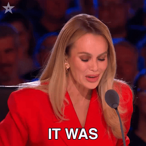 Woman In Red Jacket Speaking Into Microphone GIF