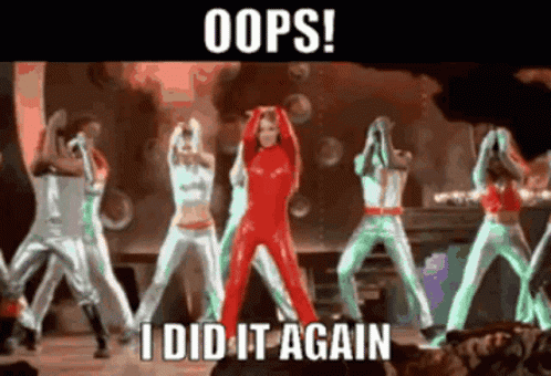 a woman in a red jumpsuit stands in front of a group of dancers with the caption oops i did it again