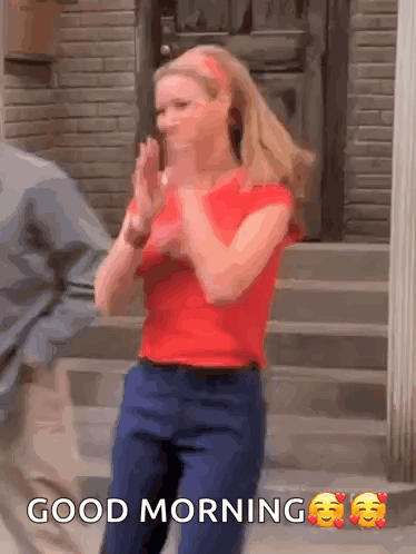 A Woman In A Red Shirt Is Clapping Her Hands And The Words Good Morning Are Above Her GIF