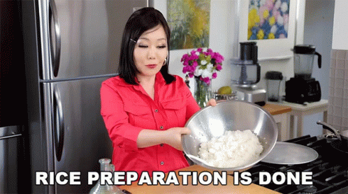 a woman in a red shirt is holding a bowl of rice with the words rice preparation is done above her
