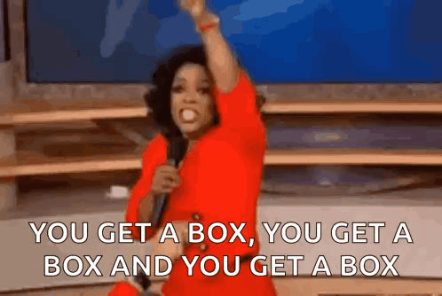A Woman In A Red Shirt Is Holding A Microphone And Saying " You Get A Box You Get A Box GIF