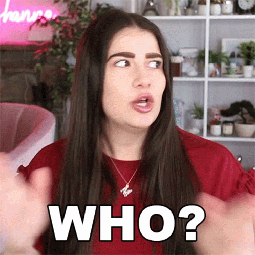 A Woman In A Red Shirt Is Making A Face And Says Who GIF