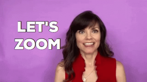A Woman In A Red Shirt Is Making A Funny Face And Saying `` Let 'S Zoom '' . GIF
