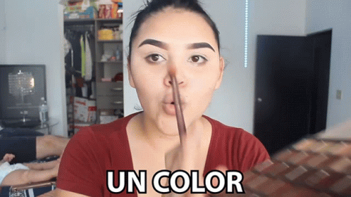 A Woman In A Red Shirt Is Making A Funny Face And The Words Un Color Are Above Her Face GIF