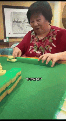 A Woman In A Red Shirt Is Playing Mahjong And Says " Oowah " GIF