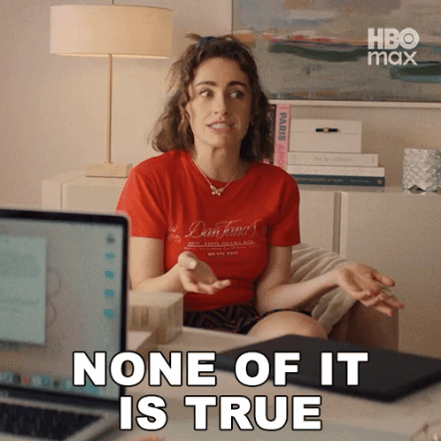 A Woman In A Red Shirt Is Sitting In Front Of A Laptop Computer And Says None Of It Is True GIF