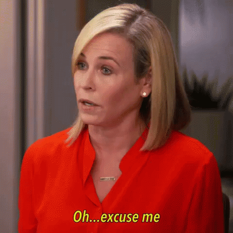 A Woman In A Red Shirt Is Talking And Saying `` Oh Excuse Me '' . GIF