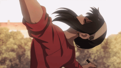 A Woman In A Red Shirt Is Upside Down With Her Arm Outstretched GIF