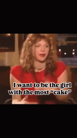 A Woman In A Red Shirt Says " I Want To Be The Girl With The Most " Cake " GIF