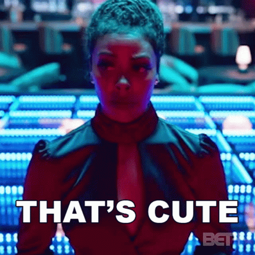 A Woman In A Red Shirt Says That 'S Cute On The Screen GIF