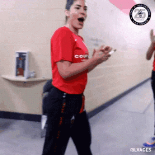 A Woman In A Red Shirt That Says Court Is Dancing GIF