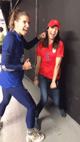 A Woman In A Red Shirt With The Number 7 On It GIF