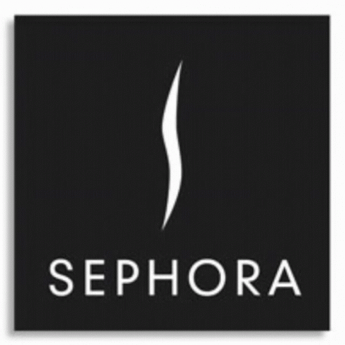 A Woman In A Red Suit Is Standing In Front Of The Sephora Logo GIF