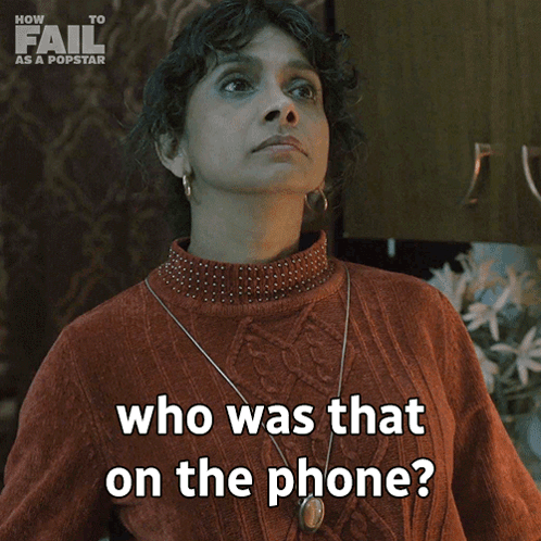 A Woman In A Red Sweater Is Asking Who Was That On The Phone GIF